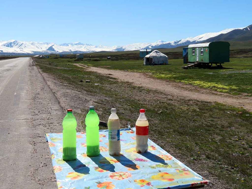 Kymyz on a roadside in used soda bottles for "Interesting Liquors from Around the World"