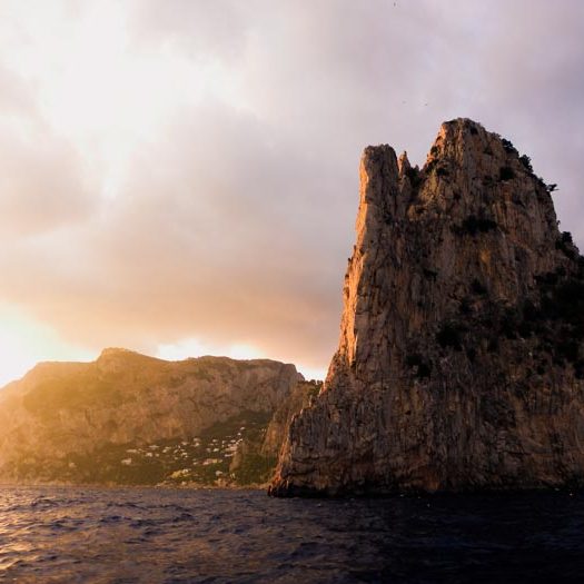 Sun setting on the coastline of Italy's island of Capri.