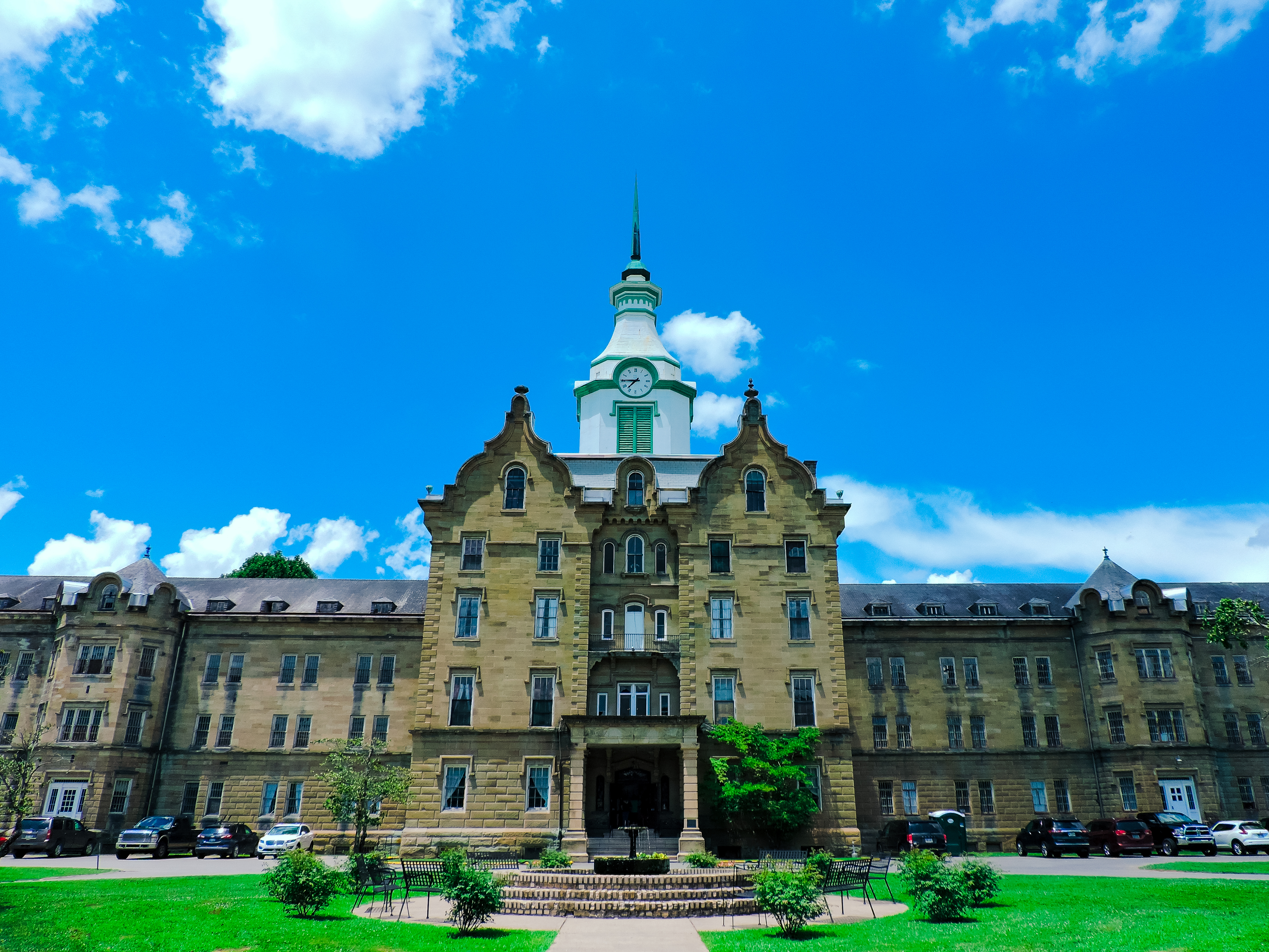 Trans-Allegheny Lunatic Asylum gothic stone building — one of the most haunted asylums in America with intense paranormal activity in Ward W. Featured on Ghost Adventures.