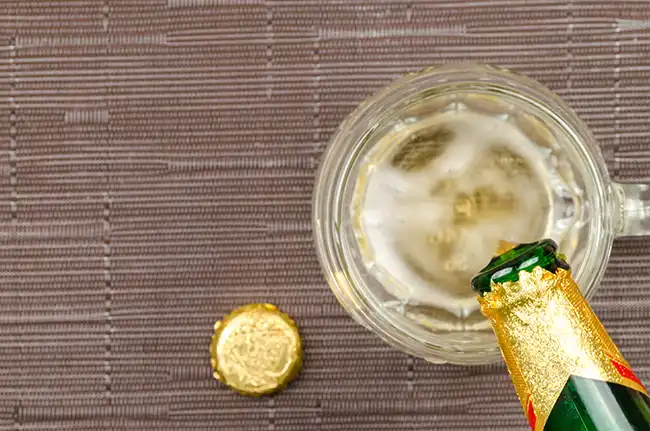 spritzer being poured for a framboise lambic ale spritzer, one of many amazing summer drinks in europe