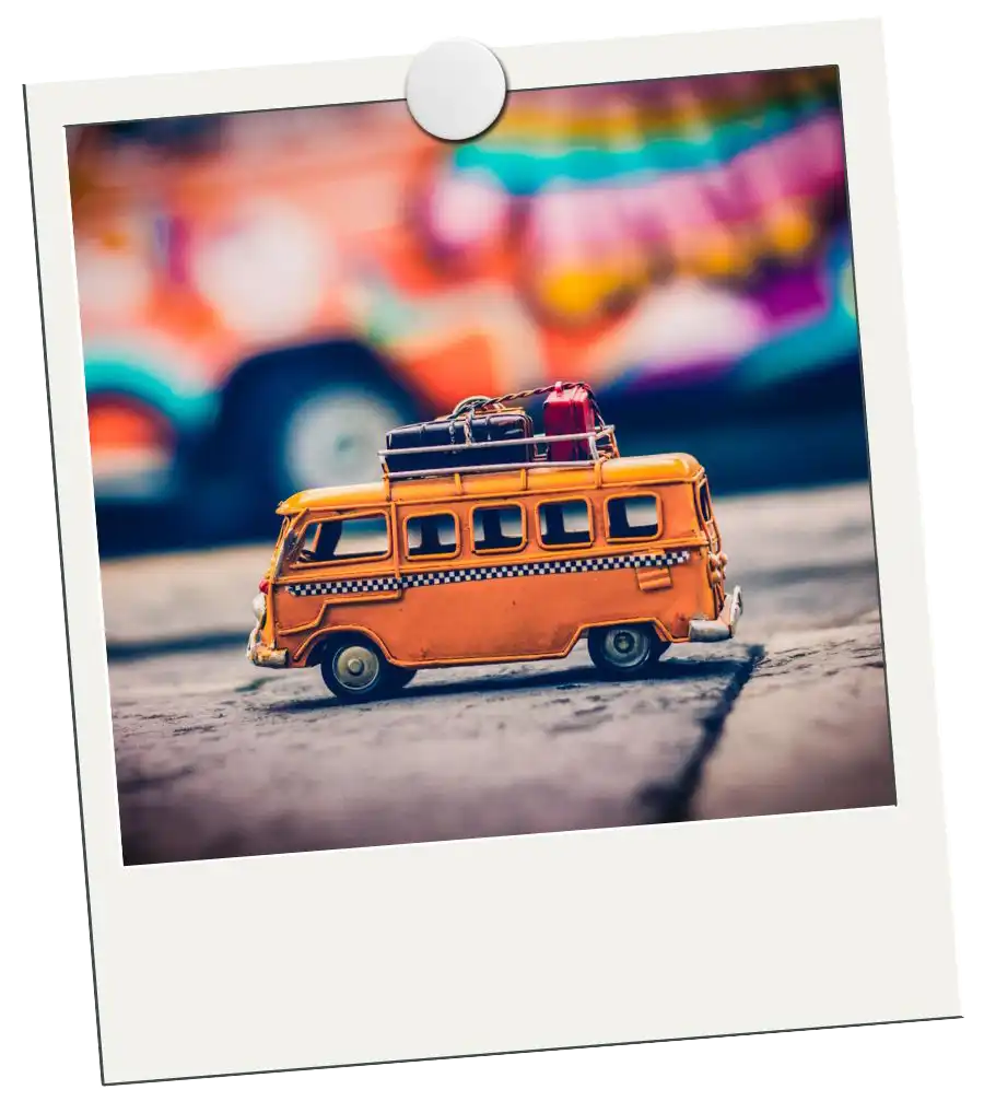 Polaroid with toy bus for Global Debauchery Destinations header